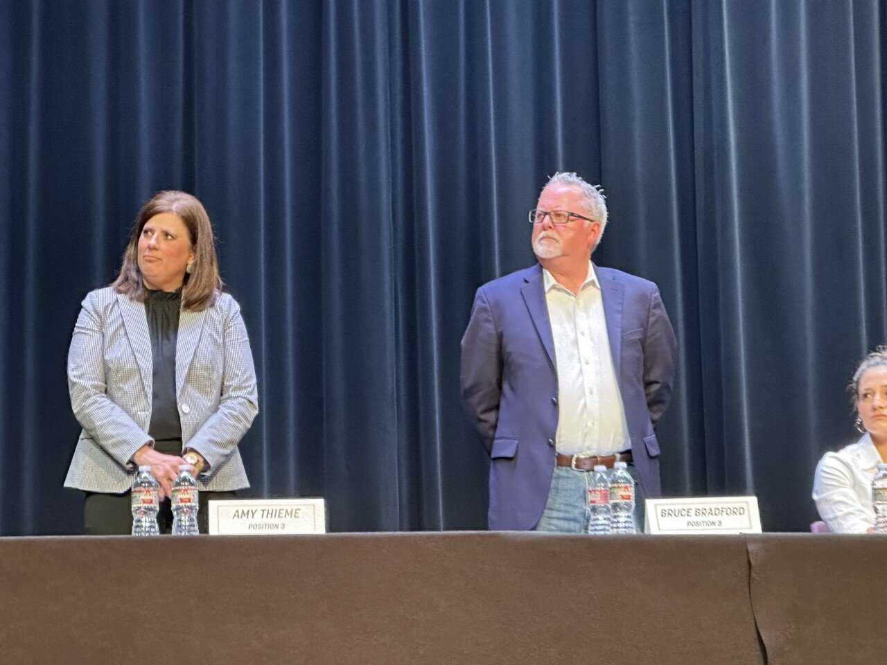 Katy ISD position 3 trustee candidates Amy Thieme, left, and Bruce Bradford stand as they are introduced at an April 13 candidate forum.